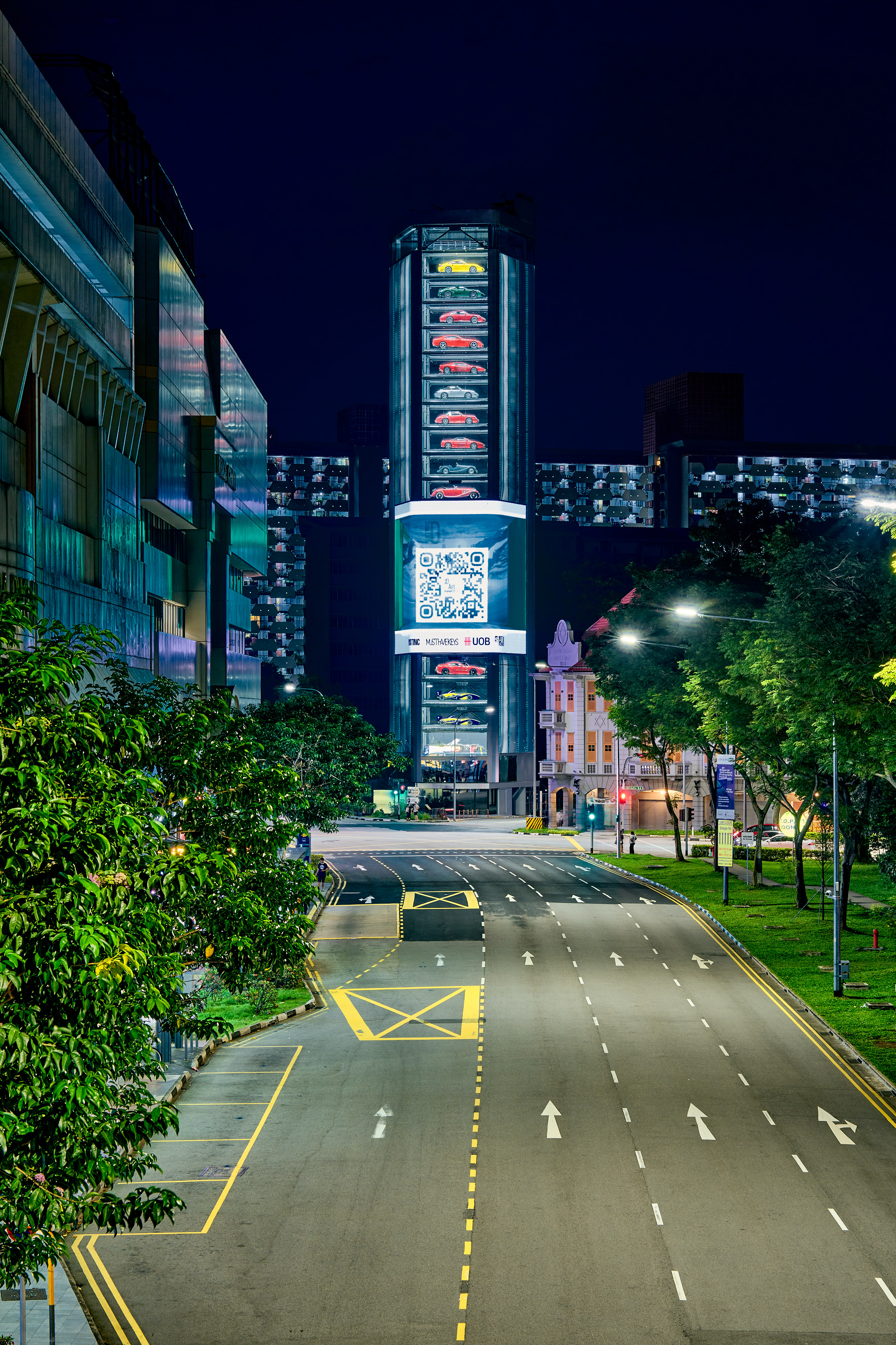 Night shot of neon signs on tall building